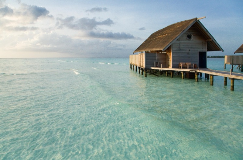 Overwater villa above the lagoon at COMO Cocoa Island, Maldives