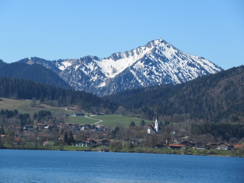 Snow-capped peak above the shore of Lake Tegernsee, Bavaria, Germany