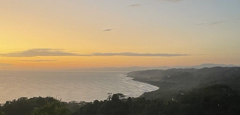 Golden-hour view over jungle hills and the coast near Santa Teresa and Mal País, Costa Rica