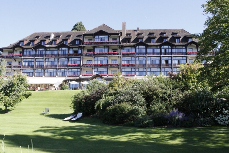 Hôtel Ermitage and its sunny lawns at Évian Resort, Évian-les-Bains, France