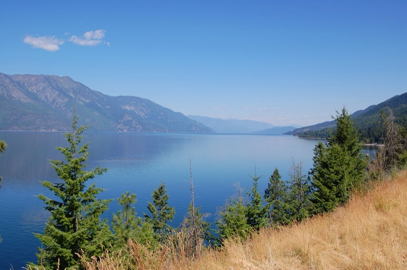 Kootenay Lake framed by evergreens and mountains, British Columbia
